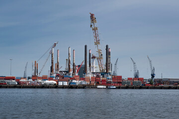 Fototapeta premium Harbor with large cranes and containers in Rotterdam, Holland