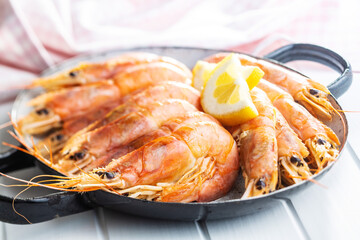 Boiled tiger prawns on pan. Tasty shrimps.