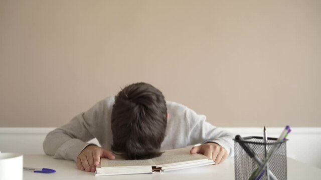 School boy having trouble with his homework