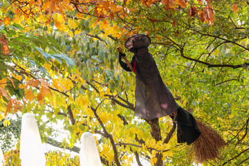 Hanging tree witch for halloween autumn decoration.