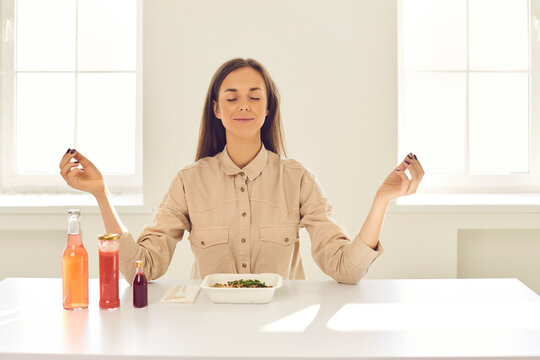 Happy Relaxed Woman Meditating Before Meal During Lunch Break At Home Or In Office