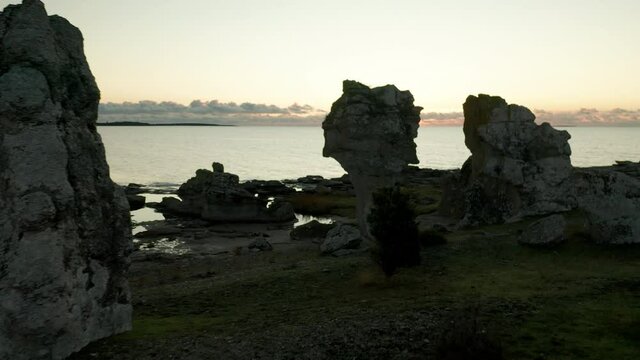 Establishing shot of Rauks sea stacks, limestones, in Gotland, Sweden,