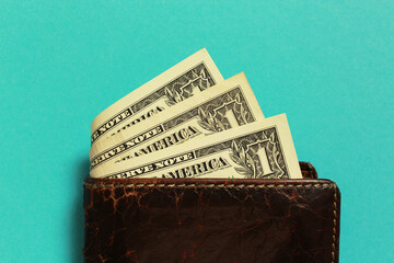 wallet with dollars on a blue background