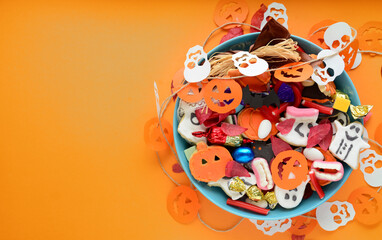 candy bowl of chocolates and sweets, Halloween Jack o Lantern cookies - Trick or Treat Halloween card background