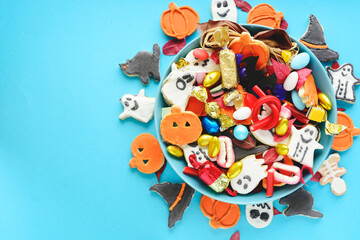 candy bowl of chocolates and sweets, Halloween Jack o Lantern cookies - Trick or Treat Halloween card background