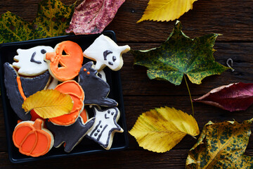 Halloween Jack o Lantern cookies, pumpkin, ghost, black cat, witch hat. Trick or Treat background	
