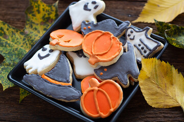 Halloween Jack o Lantern cookies, pumpkin, ghost, black cat, witch hat. Trick or Treat background	
