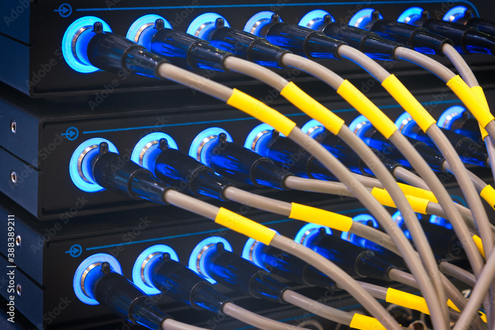 Aufkleber wires connected to the network server, optical fiber. network cables closeup with fiber optical back