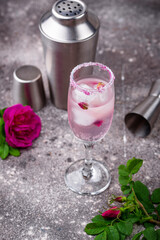 Pink cocktail with champagne and rose syrup