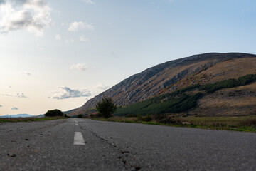 Country road through rural hillside autumn typical scene village asphalt farming ground trasnport
