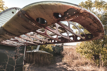 The wing of An-2 construction close-up. Antonov soviet single-engine biplane abandoned in old...