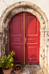 Fototapeta na wymiar Architecture of Oia town with red doors on Santorini , Greece