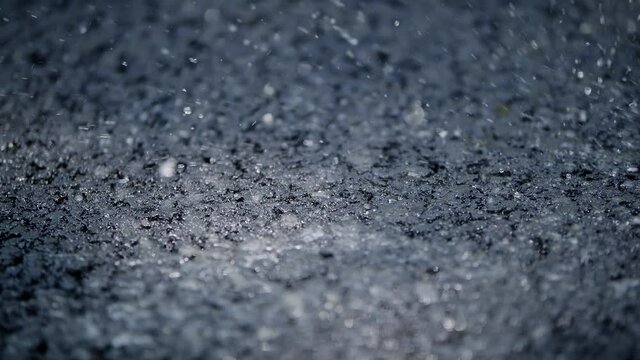 Water Poured On A Fresh Tarmac Asphalt Road 