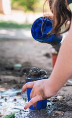 little girls playing with mud