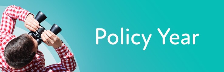Fototapeta premium Policy Year. Man observing with binoculars. Focus on text/word. Panorama format. Blue/turquoise background.