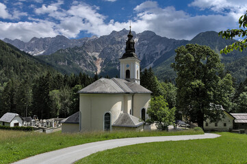 Church in the mountains. St. Ozbolt church in G.Jezersko (Slovenia) with magnificent view on Kamnik Alps.
