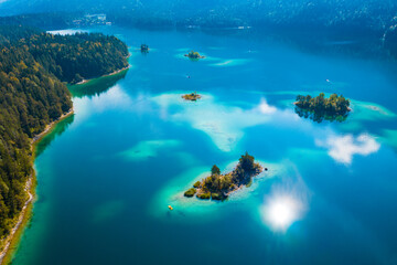 Aerial view of Eibsee lake, little islands in turquoise water