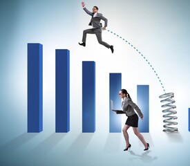 Business people jumping over bar charts