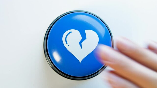 Woman pushing dislike button on white background. Close up pressing broken heart symbol. 4k video for ad, promotion, negative review, feedback. User disliking post on social media, bad, awful reaction