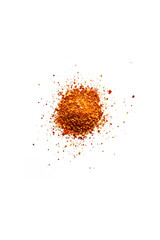 Top view of a pile of organic dry chili flakes isolated on a white background