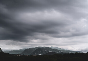 mountains over dark clouds