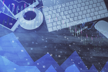 Double exposure of forex chart hologram over desktop with phone. Top view. Mobile trade platform concept.