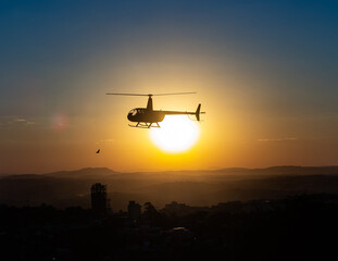 Fototapeta na wymiar helicopter at sunset