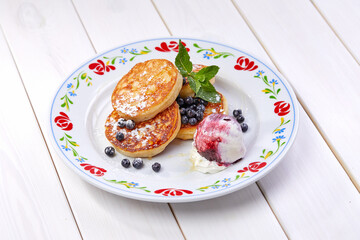 pancakes with ice cream and blueberries