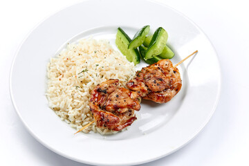 pork kebab with rice on the white plate