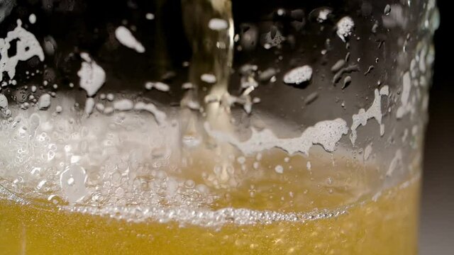 pouring beer into a glass
