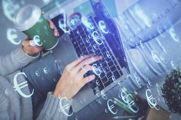 Double exposure of woman hands typing on computer and forex chart hologram drawing. Stock market invest concept.