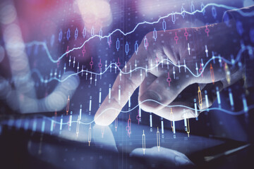 Multi exposure of man's hands holding and using a phone and financial chart drawing. Market analysis concept.