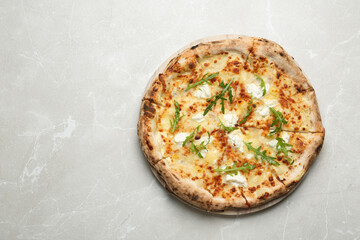 Tasty cheese pizza on light marble table, top view. Space for text
