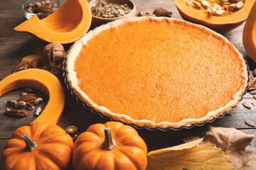 Delicious homemade pumpkin pie on wooden table