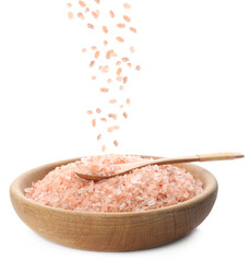 Pink himalayan salt falling into bowl on white background
