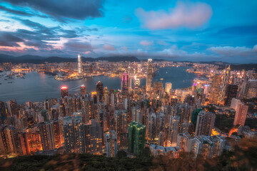 Naklejka premium Urban Brilliant and Dense Cityscape in Hong Kong with Skyscrapers during Sunset