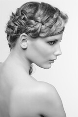 Black and white portrait in high key tone female with creative hairdo braids