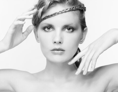 Black and white portrait in high key tone female with creative hairdo braids