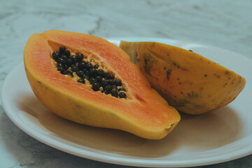 papaya fruit on a white background
