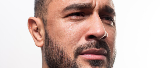 Obraz premium Closeup man crying face. Tears in eyes of cry guy.