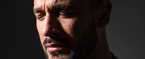 Closeup man crying face. Tears in close eyes of cry guy.