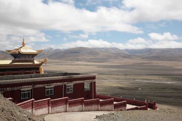 View of the famous Tibetan red sect Nyingmapa Dongga Temple at the holy mountain in Sertar county,...