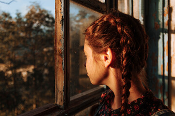girl at the old window
