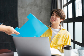 Asian businessman talking to partner about project.