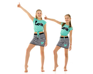 Group of children holding a thumbs up