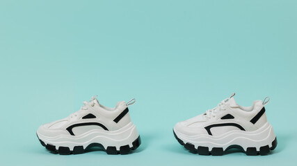Modern fashion sneakers on a light blue background. Place for text.