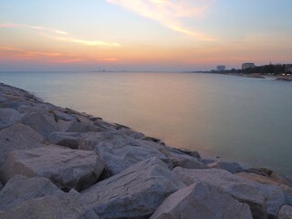 Sea, Large rocks, Twilight in the sky.