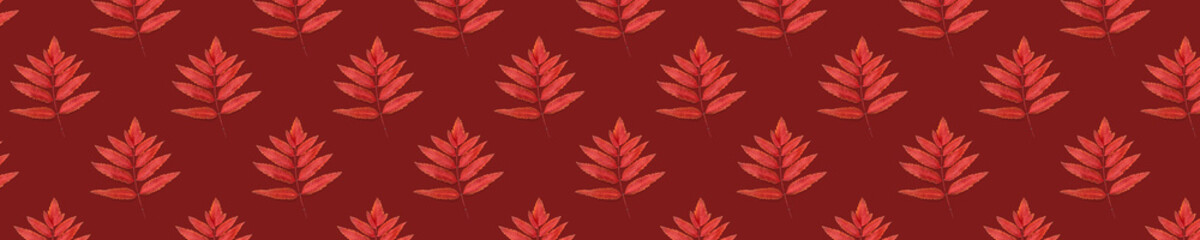 Fototapeta premium Seamless pattern from leaves of a mountain ash on a red background.