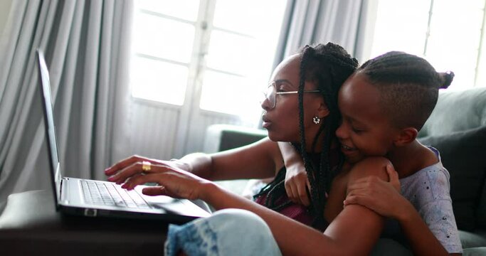 Mother Multi-tasking Working From Hom With Child, Parent Trying To Focus