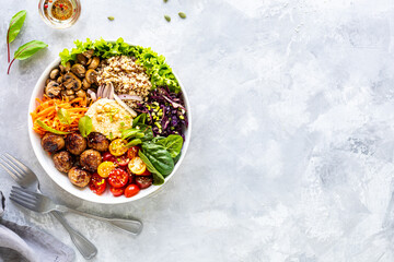 Grilled chicken, rice, spicy chickpeas, avocado, cabbage, pepper buddha bowl on white background, top view. Delicious balanced food concept